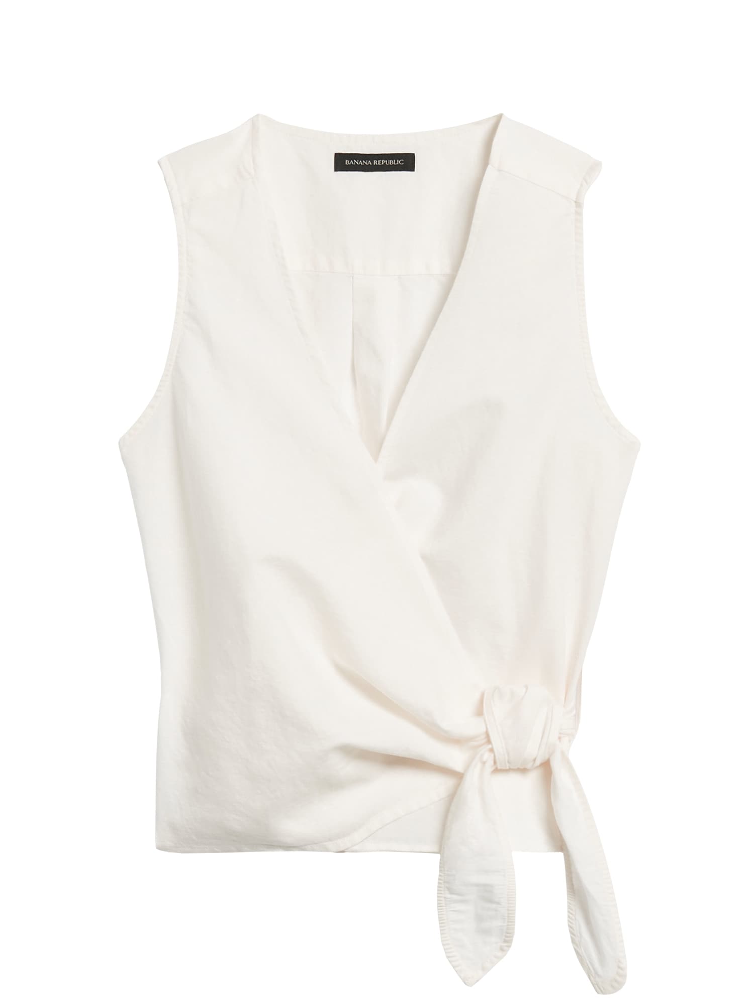 white sleeveless wrap top