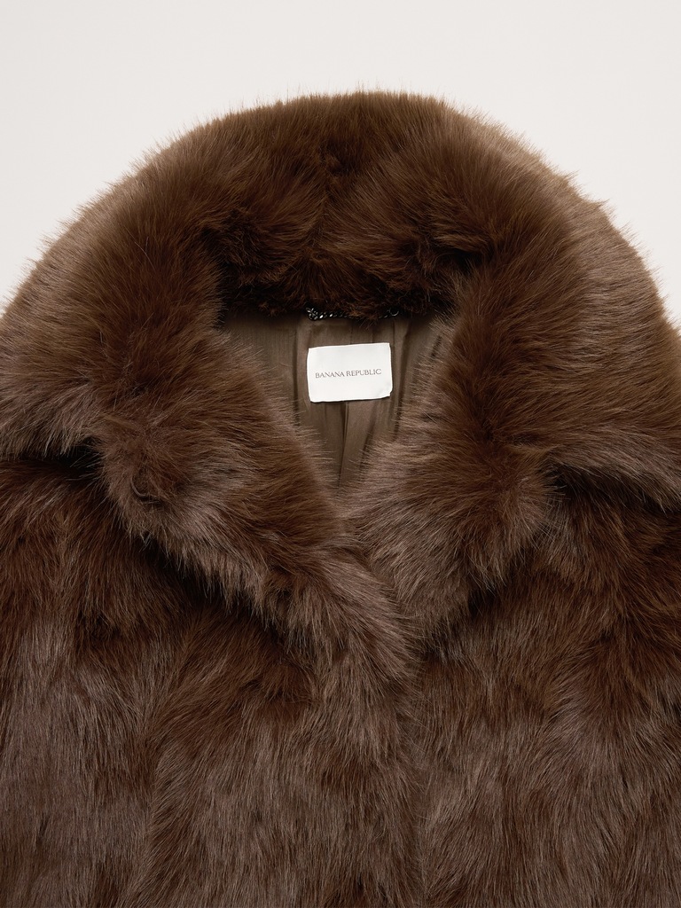 Manteau mi-long en fausse fourrure