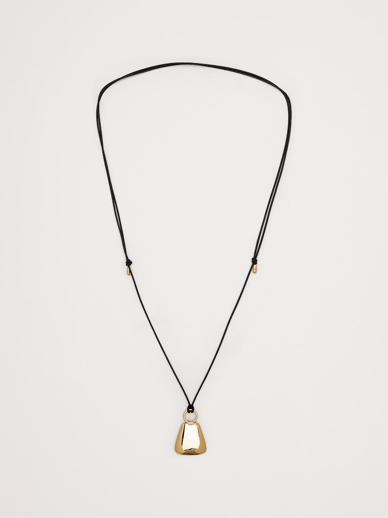 Collier en cordon de cuir avec pendentif en forme de flacon